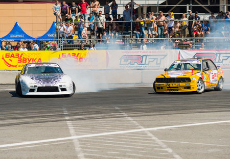 Lviv, Ukraine - Juny 7, 2015: Unknown riders on the car brand Nissan and BMW overcomes the track in...