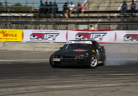 Lviv, Ukraine - Juny 6, 2015: Unknown rider on the car brand Nissan overcomes the track in the championship of Ukraine drifting in Lviv.のeditorial素材