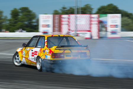 Lviv, Ukraine - Juny 7, 2015: Unknown rider on the car brand  BMW overcomes the track in the championship of Ukraine drifting in Lviv.のeditorial素材