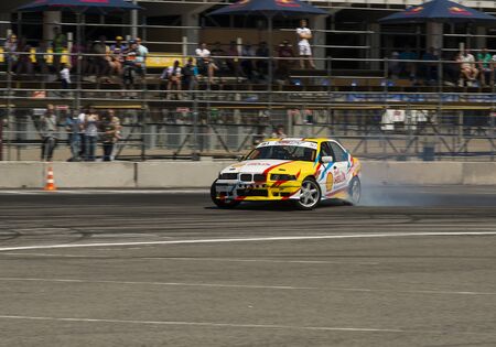 Lviv, Ukraine - Juny 6, 2015: Unknown rider on the car brand BMW overcomes the track in the championship of Ukraine drifting in Lviv.のeditorial素材
