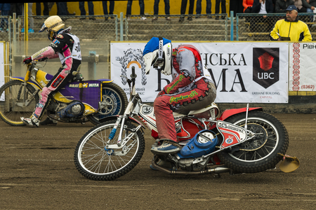 Rivne, Ukraine - 11 October 2015: Unknown riders prepares for the start at the Open Cup Speedway to the day of the city Rivneのeditorial素材