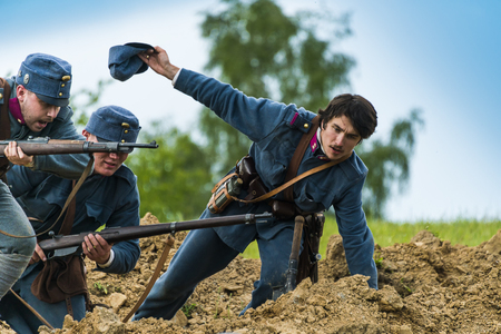 Snina, Slovakia - May 28, 2016: Military historical reconstruction battles of World War I Karpaty 1914/1916. Participants of the event stand on the attack near Snina, Slovakia.のeditorial素材