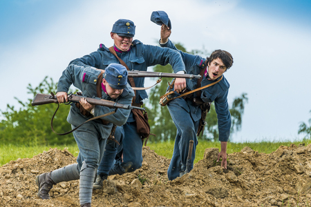 Snina, Slovakia - May 28, 2016: Military historical reconstruction battles of World War I Karpaty 1914/1916. Participants of the event stand on the attack near Snina, Slovakia.のeditorial素材