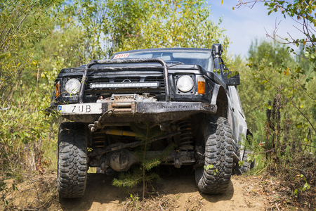 Lviv, Ukraine - August 23, 2015: Off-road vehicle brand Nissan overcomes the track on of sandy career near the city Lviv, Ukraine.のeditorial素材