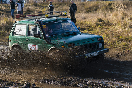 Lviv,Ukraine- December 6, 2015: Unknown rider on the off-road vehicle brand VAZ-NIVA overcomes a route off road near the city of Lviv, Ukraineのeditorial素材