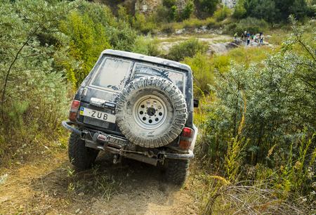 Lviv, Ukraine - August 23, 2015: Off-road vehicle brand Nissan overcomes the track on of sandy career near the city Lviv, Ukraine.のeditorial素材