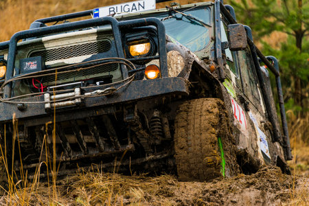 Lviv, Ukraine - February 21, 2016: Off-road vehicle UAZ (No. 221) overcomes the track on of landfill...