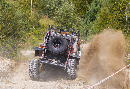 lLviv, Ukraine - August 23, 2015: Upgraded off-road vehicle  overcomes the track on of sandy career near the city Lviv, Ukraine.のeditorial素材