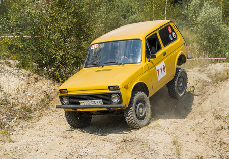 Lviv, Ukraine - August 23, 2015: Off-road vehicle brand VAZ- NIVA overcomes the track on of sandy career near the city Lviv, Ukraine.のeditorial素材