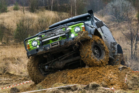 Lviv, Ukraine - February 21, 2016: Off-road vehicle brand Nissan  overcomes the track on a amateur competitions Trial near the city Lviv, Ukraineのeditorial素材