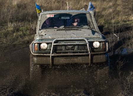 Lviv,Ukraine- December 6, 2015: Unknown rider on the off-road vehicle brand Nissan Patroll overcomes a route off road near the city of Lviv, Ukraineのeditorial素材