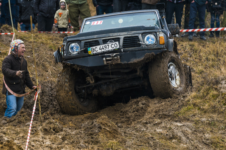 Lviv, Ukraine - February 21, 2016: Off-road vehicle brand Nissan (No. 277) overcomes the track on a amateur competitions Trial near the city Lviv, Ukraineのeditorial素材