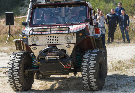lLviv, Ukraine - August 23, 2015: Upgraded off-road vehicle  overcomes the track on of sandy career near the city Lviv, Ukraine.のeditorial素材