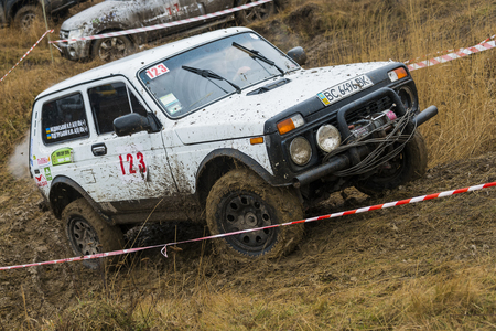 Lviv, Ukraine - February 21, 2016: Off-road vehicle brand VAZ - NIVA (No. 123) overcomes the track on a amateur competitions Trial near the city Lviv, Ukraineのeditorial素材
