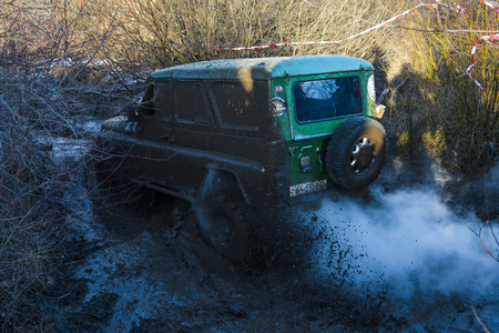 Lviv,Ukraine- December 6, 2015: Off-road vehicle brand UAZ overcomes the track on a polygon near the city Lviv, Ukraineのeditorial素材