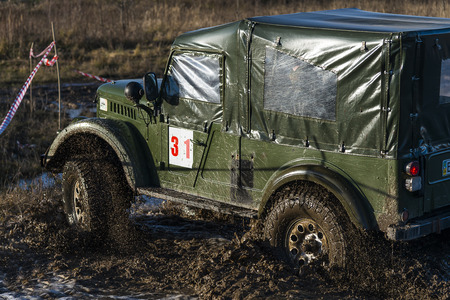 Lviv,Ukraine- December 6, 2015: Off-road vehicle brand GAZ - 69 overcomes the track on a polygon near the city Lviv, Ukraineのeditorial素材