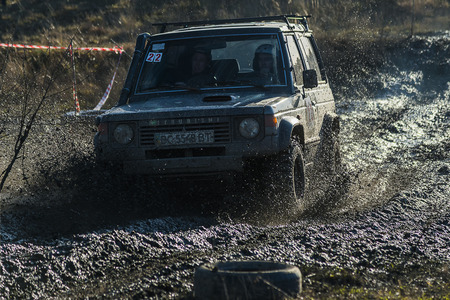 Lviv,Ukraine- December 6, 2015: Off-road vehicle brand Mitsubishi Pajero overcomes the track on a polygon near the city Lviv, Ukraineのeditorial素材