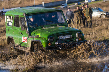 Lviv,Ukraine- December 6, 2015: Off-road vehicle brand UAZ overcomes the track on a polygon near the city Lviv, Ukraineのeditorial素材