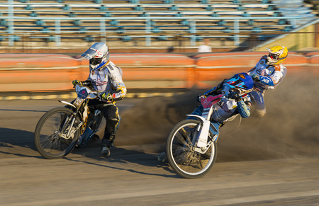 Rivne, Ukraine - 29 August 2015: Unknown riders overcomes the track at the Open Cup Speedway to the day of the city Rivneのeditorial素材