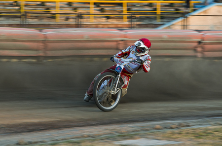 Rivne, Ukraine - 29 August 2015: Unknown rider overcomes the track at the Open Cup Speedway to the day of the city Rivneのeditorial素材