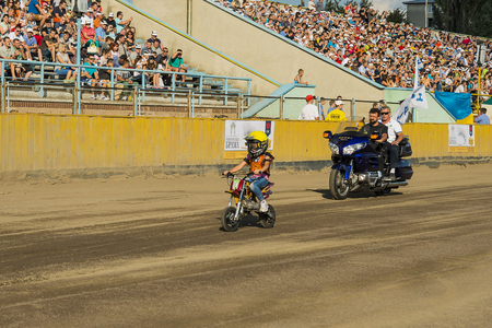 Rivne, Ukraine - 11 October 2015: Young rider overcomes the track during the opening the Open Cup Speedway to the day of the city Rivneのeditorial素材