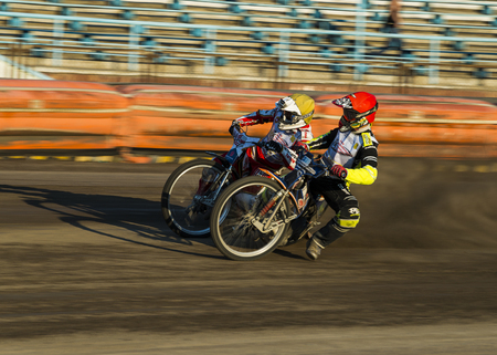 Rivne, Ukraine - 29 August 2015: Unknown riders overcomes the track at the Open Cup Speedway to the day of the city Rivneのeditorial素材