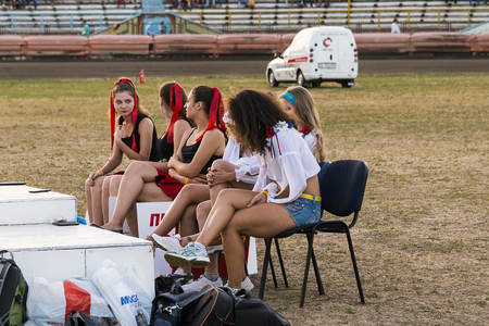 Rivne, Ukraine - 29 August 2015: Pit lane girls getting ready for a competition on the Open Cup Speedway to the day of the city Rivneのeditorial素材