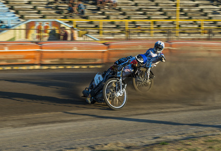 Rivne, Ukraine - 29 August 2015: Unknown riders overcomes the track at the Open Cup Speedway to the day of the city Rivneのeditorial素材