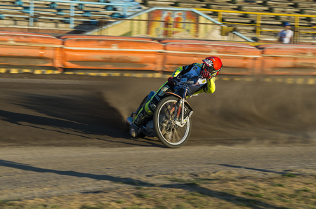 Rivne, Ukraine - 29 August 2015: Unknown rider overcomes the track at the Open Cup Speedway to the day of the city Rivneのeditorial素材