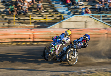 Rivne, Ukraine - 29 August 2015: Unknown riders overcomes the track at the Open Cup Speedway to the day of the city Rivneのeditorial素材