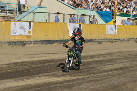 Rivne, Ukraine - 11 October 2015: Young rider overcomes the track during the opening the Open Cup Speedway to the day of the city Rivneのeditorial素材