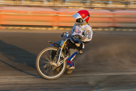 Rivne, Ukraine - 29 August 2015: Unknown rider overcomes the track at the Open Cup Speedway to the day of the city Rivneのeditorial素材