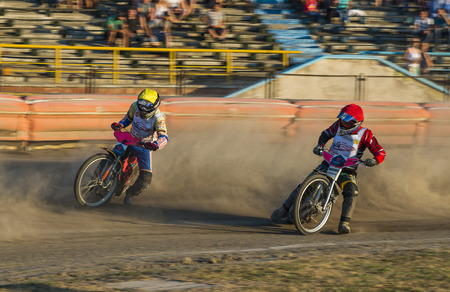 Rivne, Ukraine - 29 August 2015: Unknown riders overcomes the track at the Open Cup Speedway to the day of the city Rivneのeditorial素材