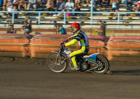 Rivne, Ukraine - 29 August 2015: Unknown rider overcomes the track at the Open Cup Speedway to the day of the city Rivneのeditorial素材