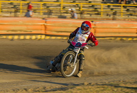 Rivne, Ukraine - 29 August 2015: Unknown rider overcomes the track at the Open Cup Speedway to the day of the city Rivneのeditorial素材