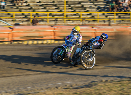 Rivne, Ukraine - 29 August 2015: Unknown riders overcomes the track at the Open Cup Speedway to the day of the city Rivneのeditorial素材
