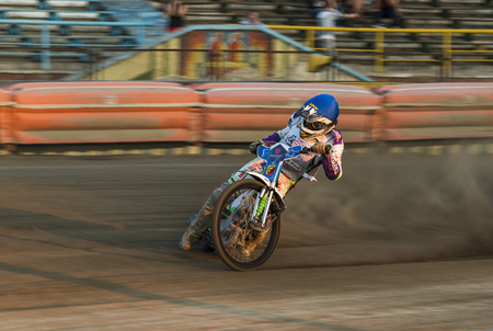 Rivne, Ukraine - 29 August 2015: Unknown rider overcomes the track at the Open Cup Speedway to the day of the city Rivneのeditorial素材