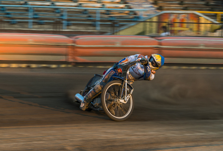 Rivne, Ukraine - 29 August 2015: Unknown rider overcomes the track at the Open Cup Speedway to the day of the city Rivneのeditorial素材