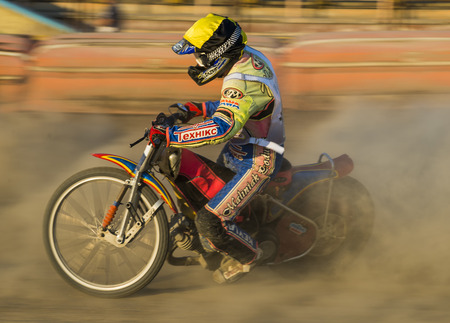 Rivne, Ukraine - 29 August 2015: Unknown rider overcomes the track at the Open Cup Speedway to the day of the city Rivneのeditorial素材