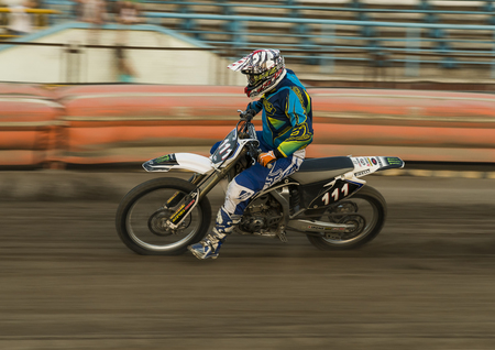 Rivne, Ukraine - 29 August 2015: Unknown rider overcomes the track at the Open Cup Speedway to the day of the city Rivneのeditorial素材