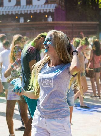 Lviv, Ukraine - August 30, 2015: Girl have fun during the festival of color in a city park in Lviv.のeditorial素材