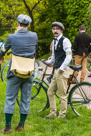 Lviv, Ukraine - May 7, 2016; Unknown  participants of retro Bike rally await  the  start in the city park in Lviv.のeditorial素材
