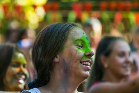 Lviv, Ukraine - August 28, 2016: Girl having fun during the festival of color in a city park in Lviv.のeditorial素材