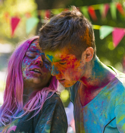 Lviv, Ukraine - August 28, 2016: Young people speak  during the festival of color in a city park in Lviv.のeditorial素材