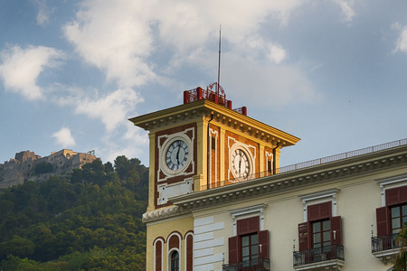 Clock tower with bells on clear blue skyの写真素材