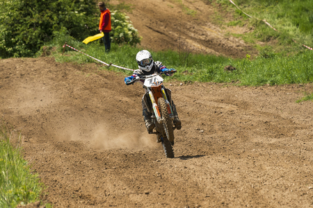 Lviv, Ukraine - May 20 2018:  Open Cup of Lviv on the motocross track Mayorovka. Unknown motorcycle racer overcomes motocross track in the fight for the championship.のeditorial素材