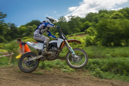 Lviv, Ukraine - May 20 2018:  Open Cup of Lviv on the motocross track Mayorovka. Unknown motorcycle racer overcomes motocross track in the fight for the championship.のeditorial素材