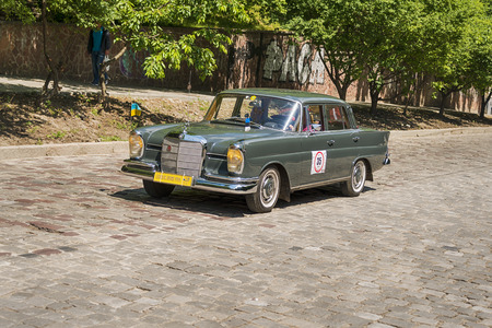 Lviv, Ukraine - June 3, 2018:Old retro car Mercedes Benz 220se (1963) with its owner and an unknown passenger taking participation in race Leopolis grand prix 2018, Ukraine.のeditorial素材