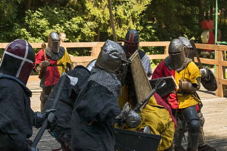 Lviv , Ukraine â august , 04, 2018:  Festival of medieval history and knight duels in the city park in Lviv.Knights fight in group battlesのeditorial素材