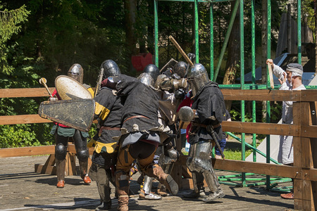 Lviv , Ukraine â august , 04, 2018:  Festival of medieval history and knight duels in the city park in Lviv.Knights fight in group battlesのeditorial素材